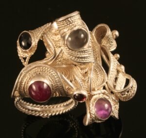 Silver ring with gemstones.